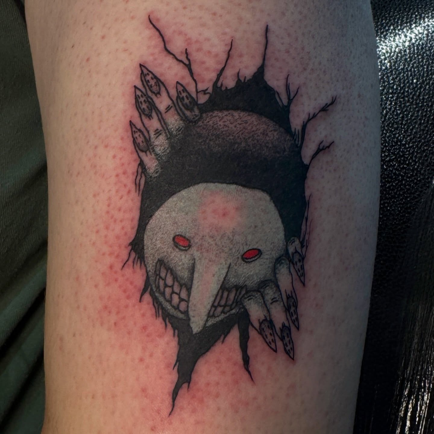 Skull with claws dark realism tattoo on the forearm by Seth Christianson