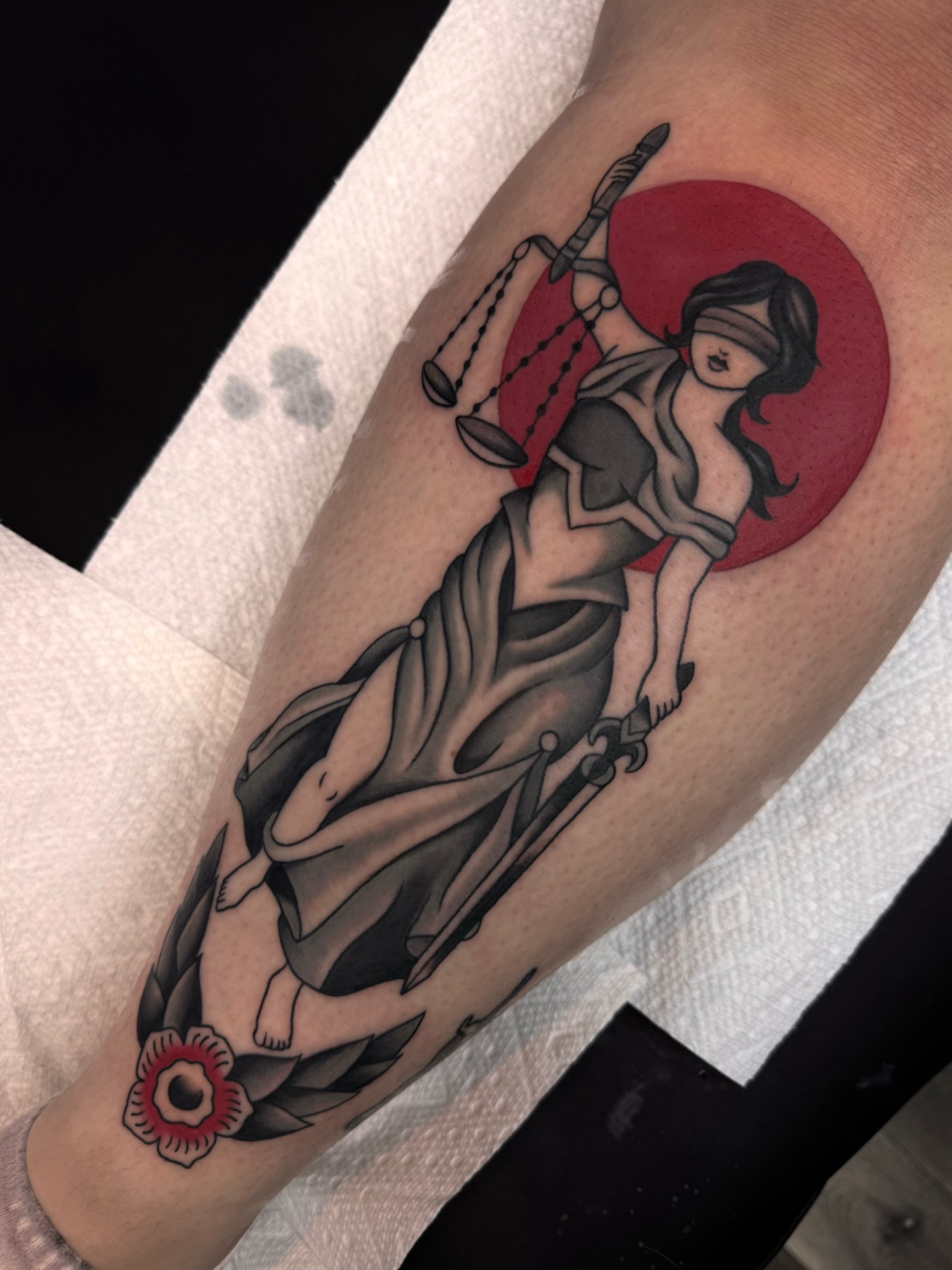 Lady Justice American traditional tattoo on the forearm by Suda