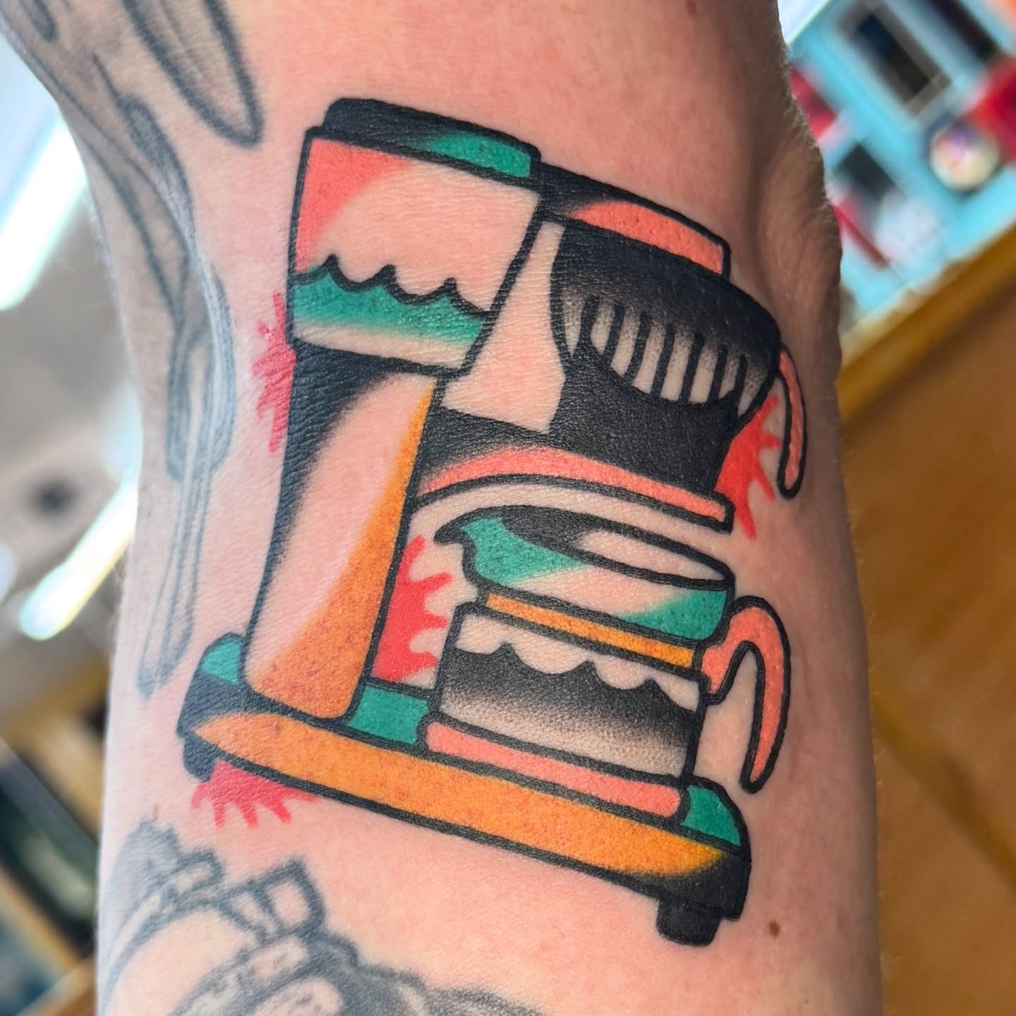Coffee maker American traditional tattoo on the forearm by Sam