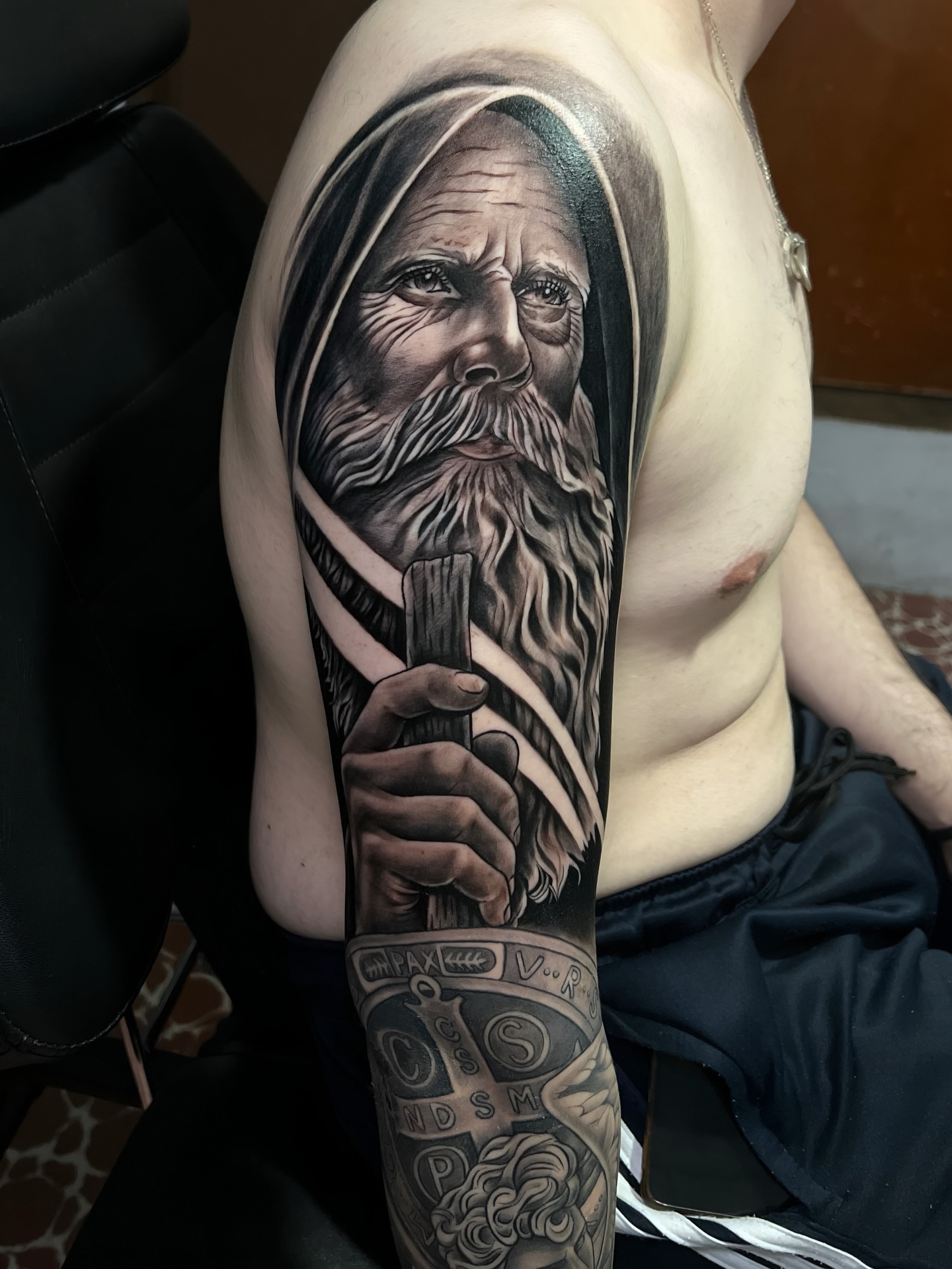 Old man with staff realism tattoo on the upper arm by ⚜️Lalo Godina Tattoo⚜️