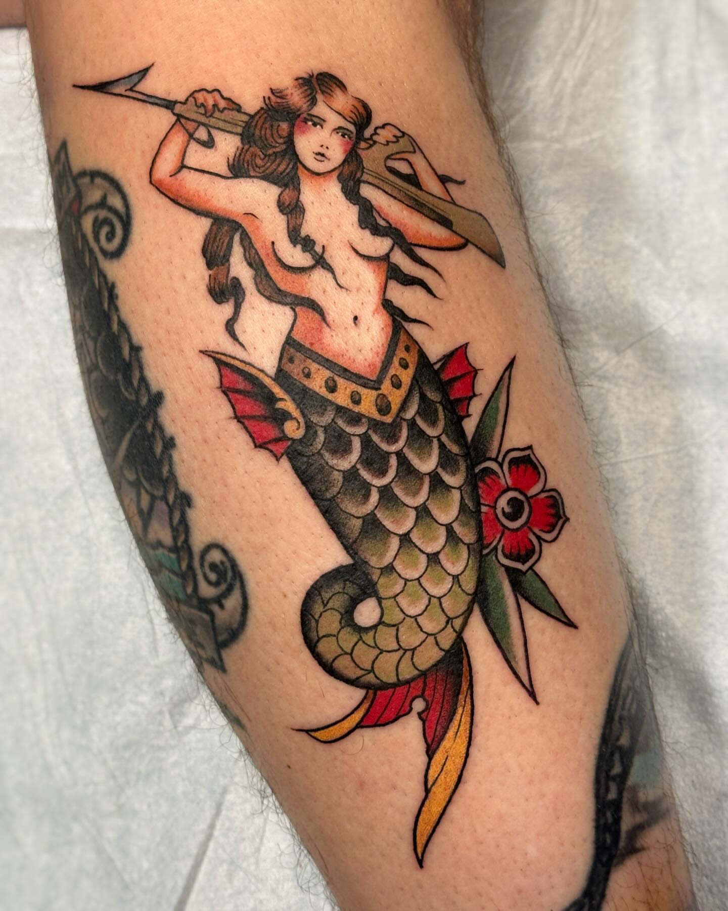 Mermaid American traditional tattoo on the forearm by Craig Ryans
