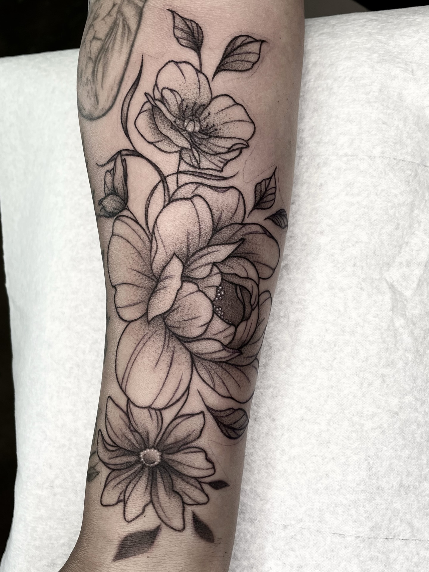 Flowers dotwork tattoo on the forearm by Ducky