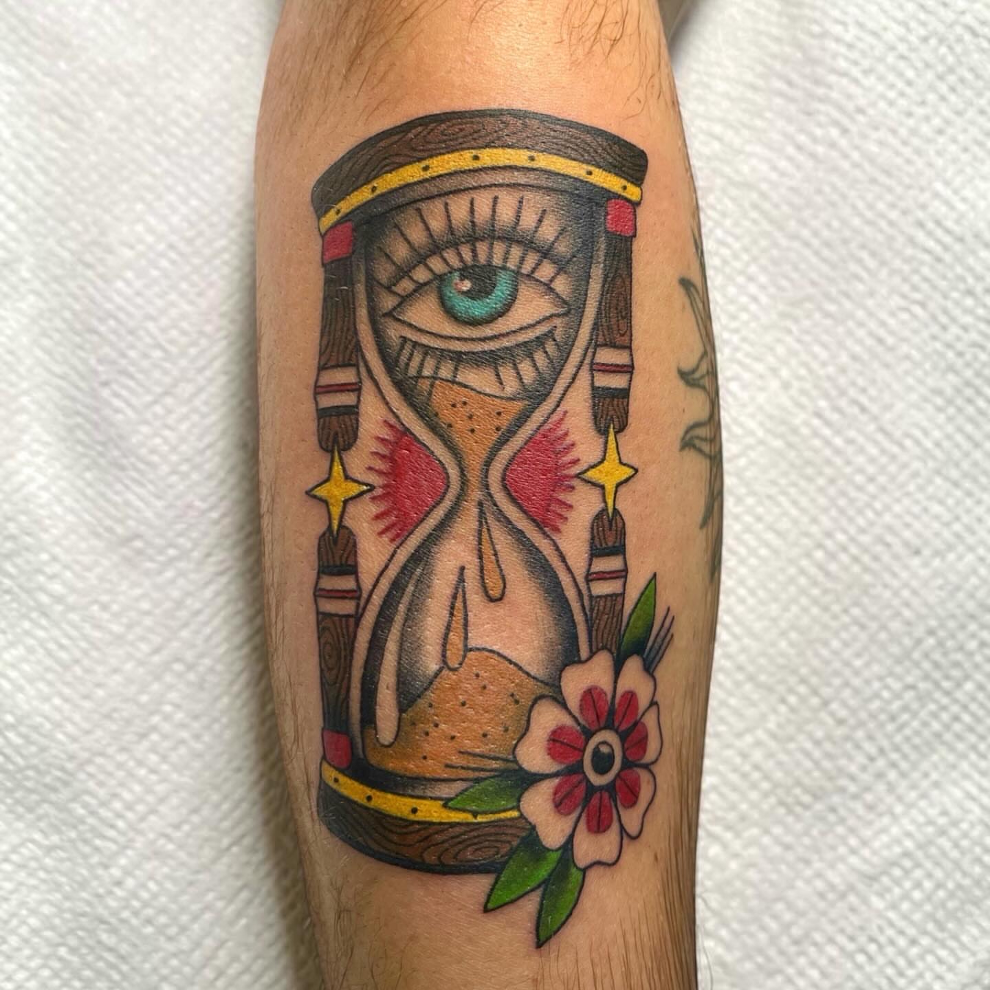 Hourglass with eye American traditional tattoo on the forearm by Brooke Kresco