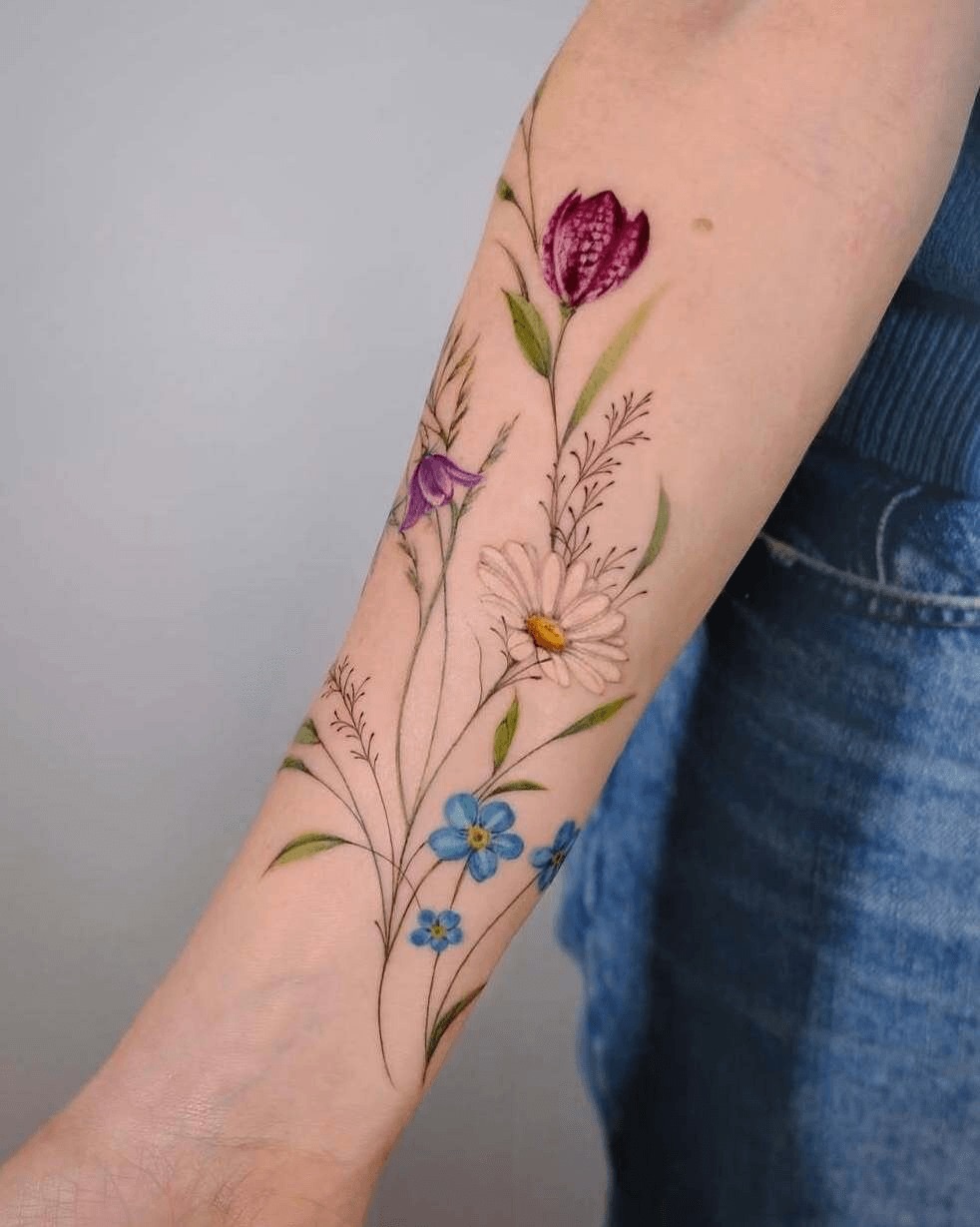 Floral arrangement watercolor tattoo on the forearm by Thin line and color TATTOO.