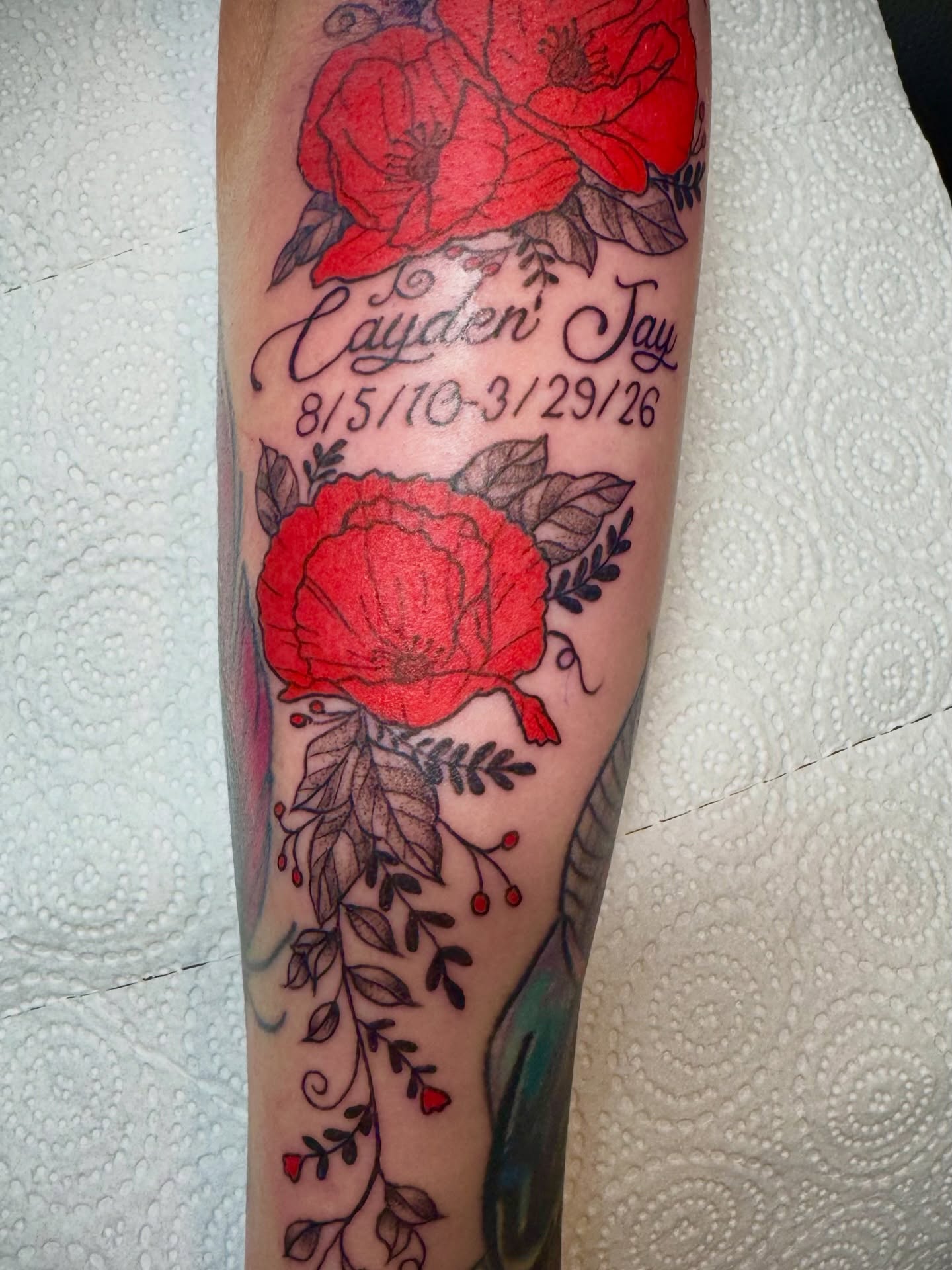 Red poppies American traditional tattoo on the forearm by Bronzino Ink - Karen, Asheville, North Carolina