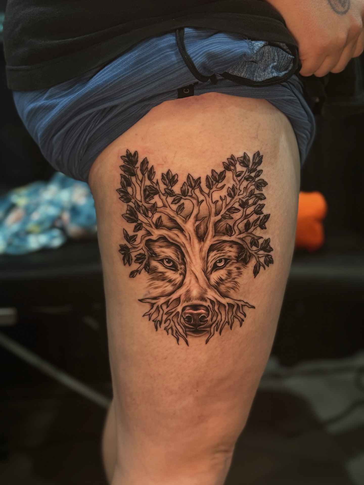 Tree with animal face realism tattoo on the thigh by Lily Nurnberger