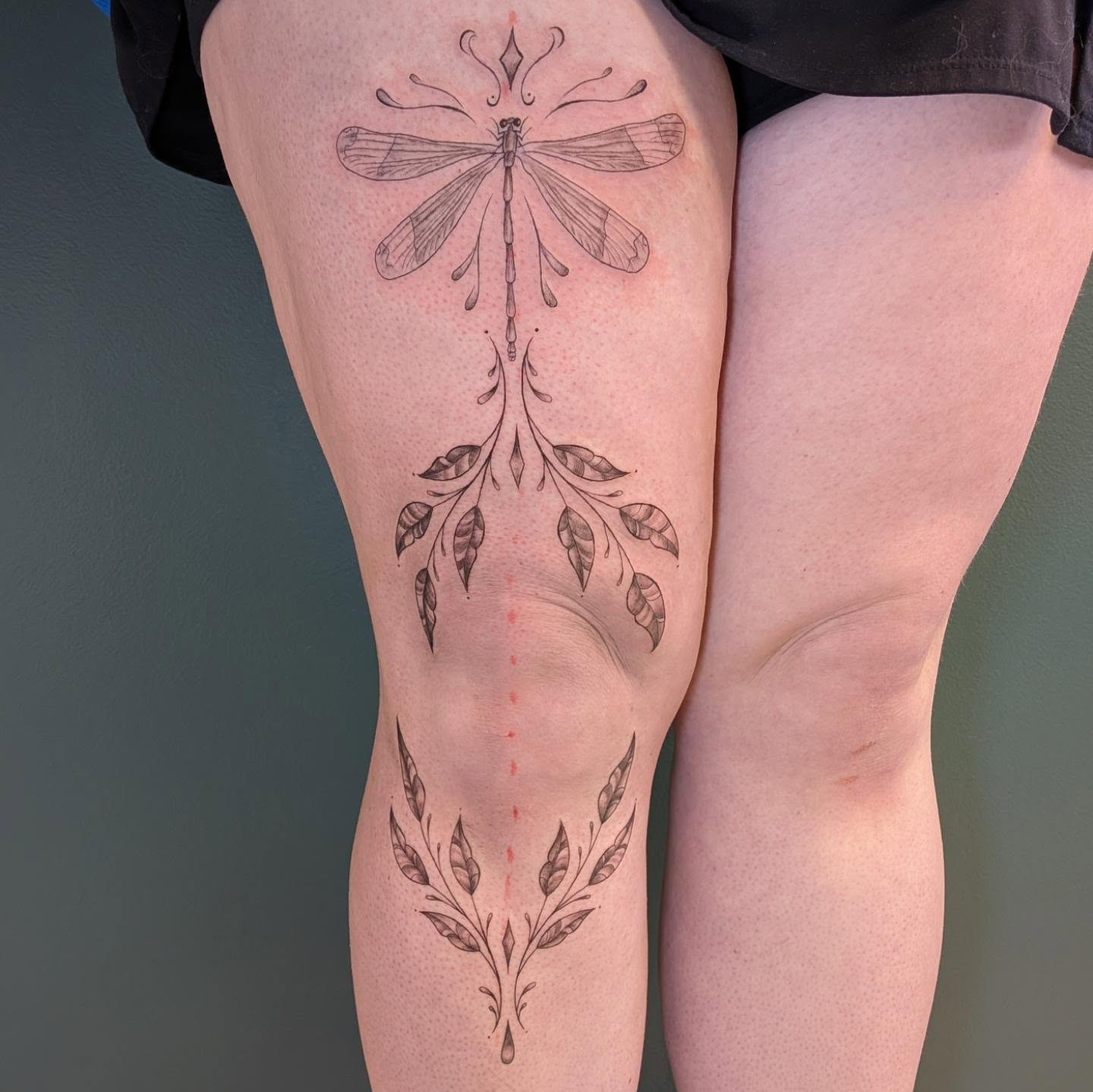 Dragonfly black and grey tattoo on the thigh by L U C y, Knoxville, Tennessee