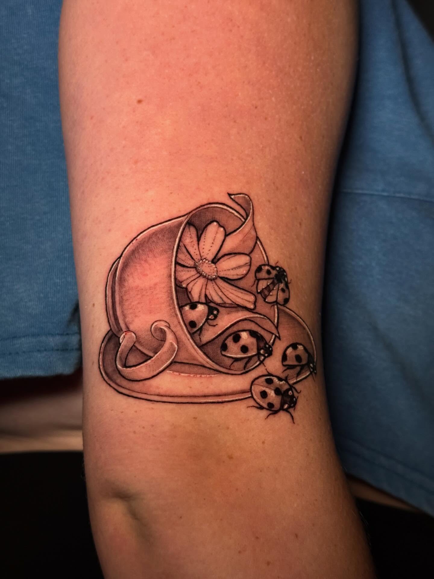 Flower pot with ladybugs black and grey tattoo on the forearm by Andreanna Rosemarie Gabranidis, Pennsauken, New Jersey