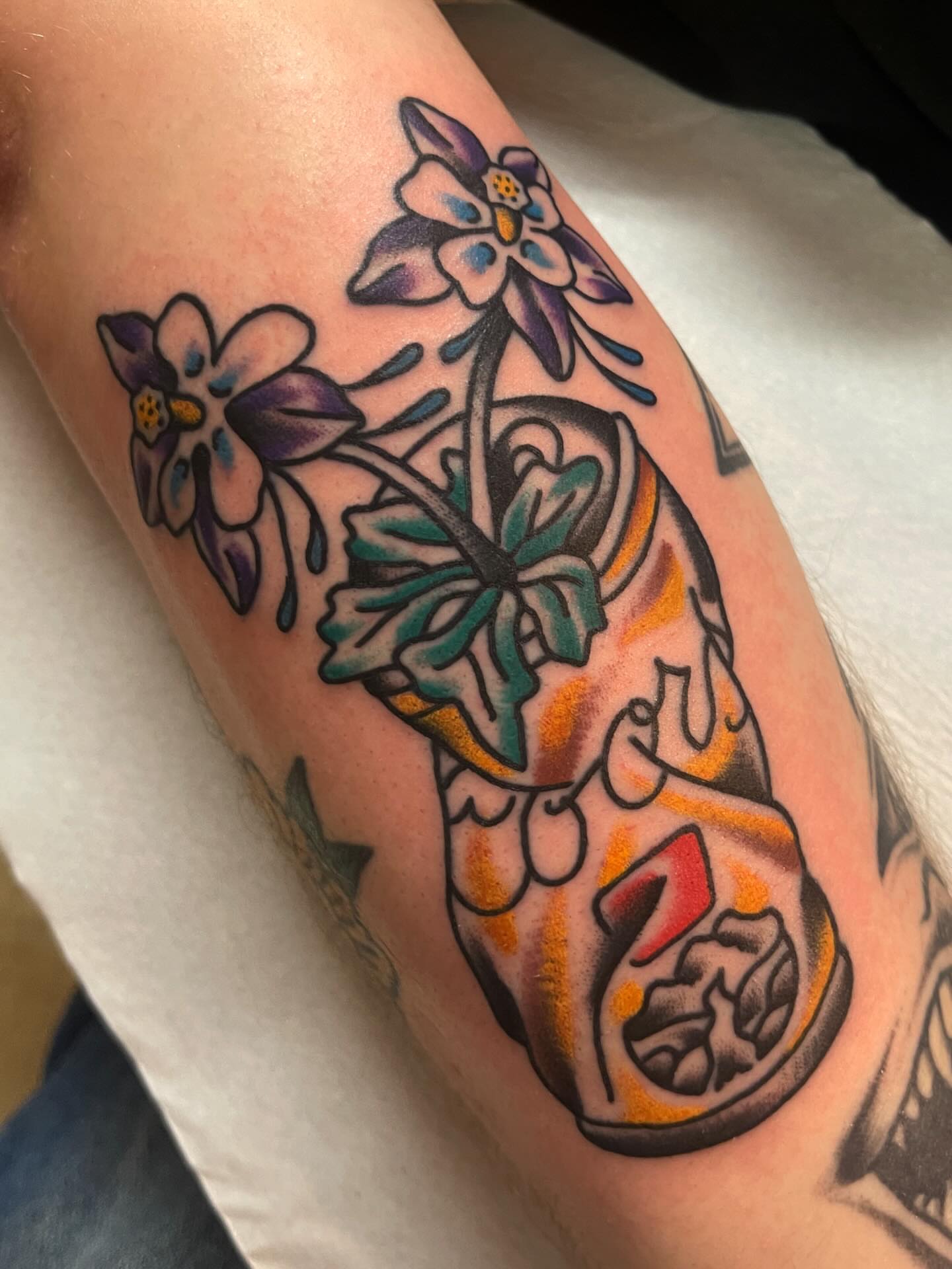 California state flower and map American traditional tattoo on the forearm by Spencer Reisbeck