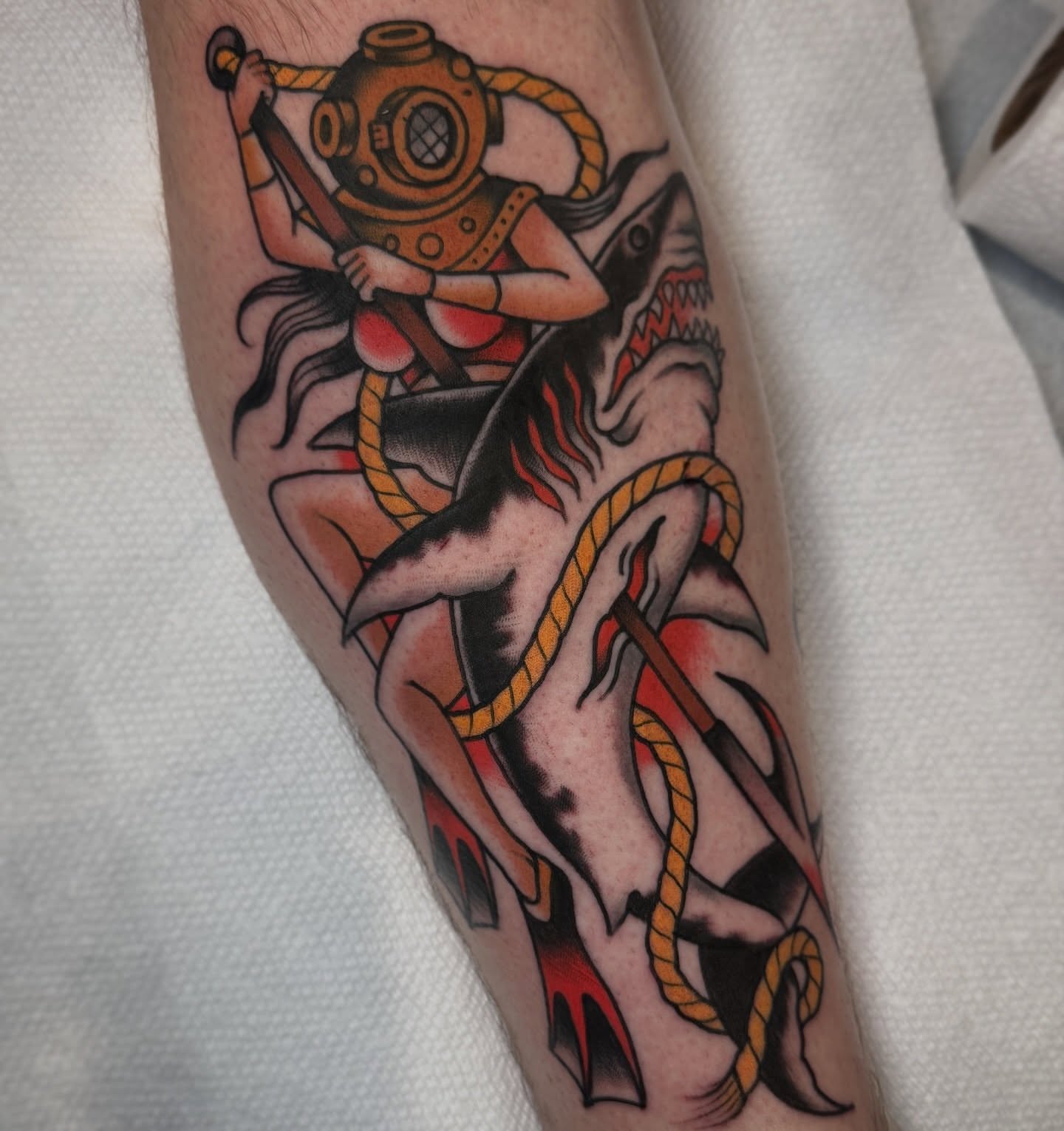 Diver and shark American traditional tattoo on the forearm by K y l e   M a c K e n z i e, Salem, Massachusetts