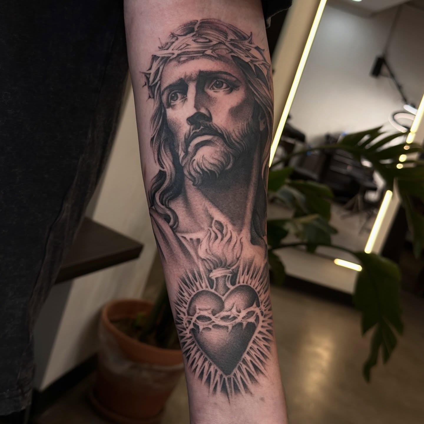 Jesus Christ realism tattoo on the forearm by Joe Cruz