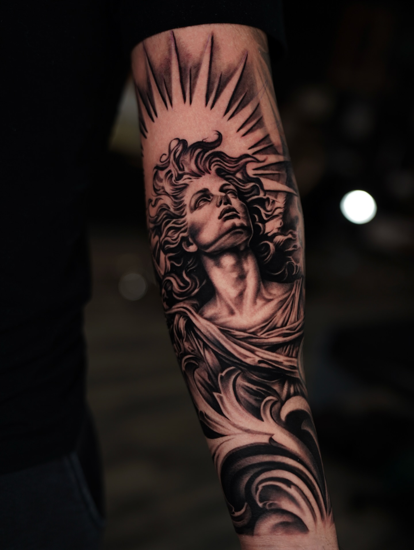 Statue of a woman realism tattoo on the forearm by Flamure Islami