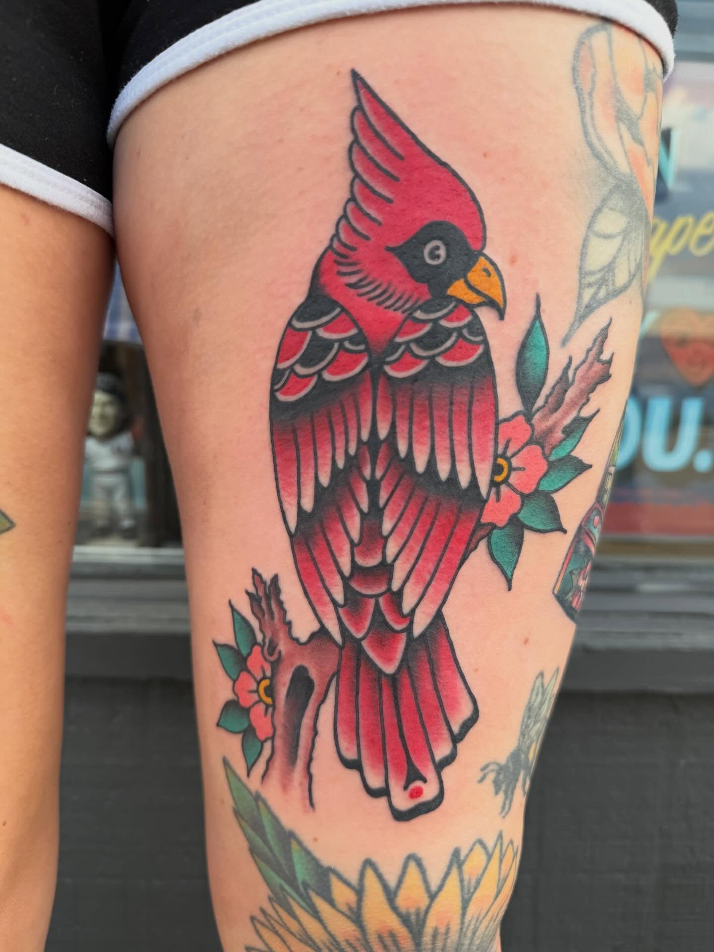 Cardinal bird American traditional tattoo on the thigh by Atom Aker