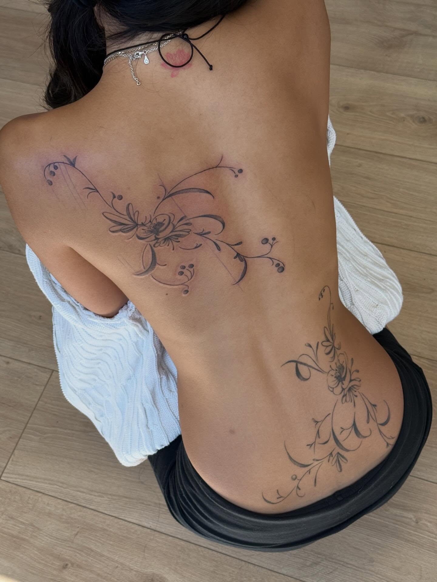 Floral design black and grey tattoo on the back by Rachel ˚⊱🪷⊰˚ 芷若, Des Moines, Iowa