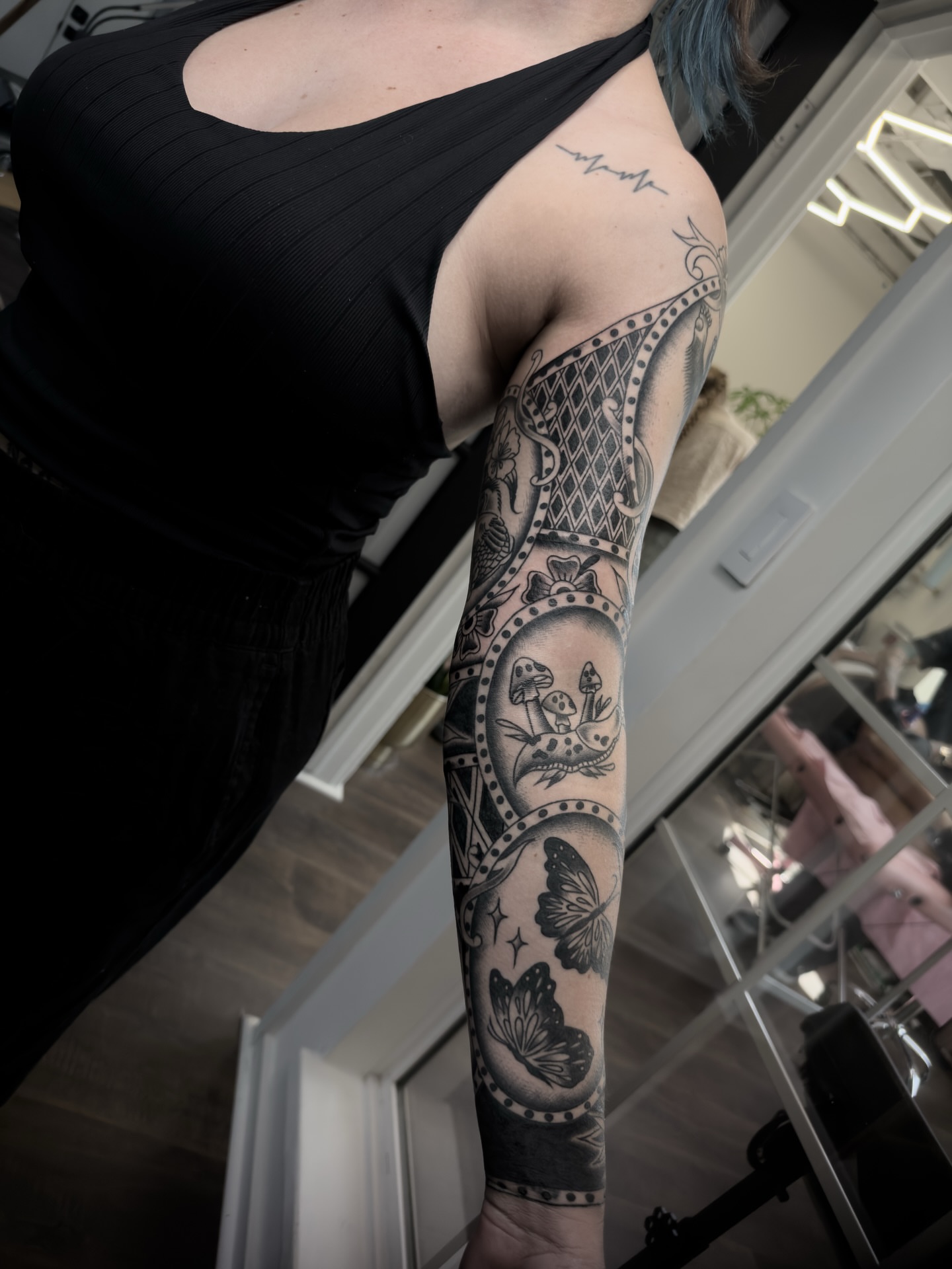 Mushroom and butterfly black and grey tattoo on the forearm by ⚔️Andreas Dolleschal⚔️