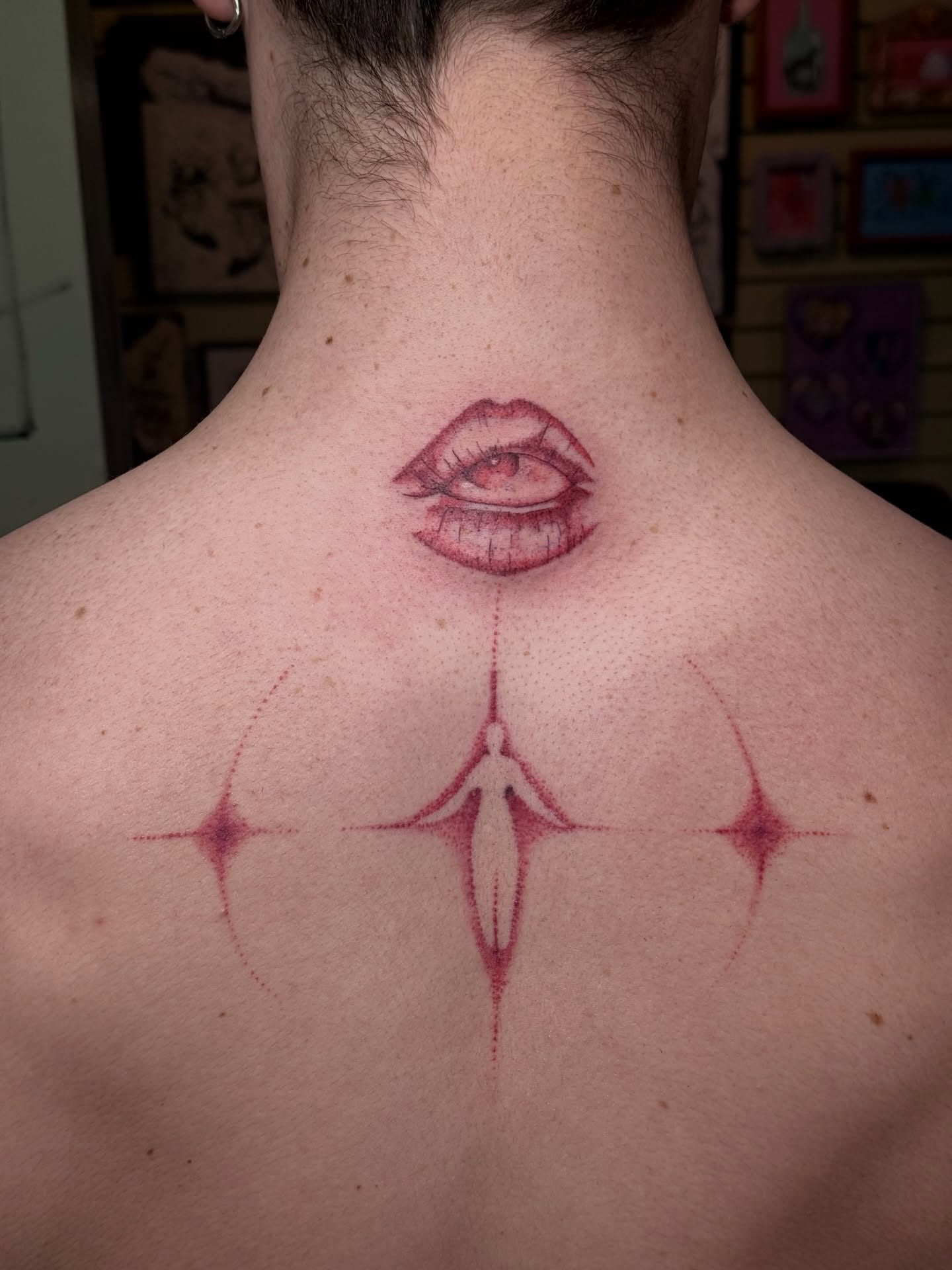 Eye and lips dotwork tattoo on the neck by Mo