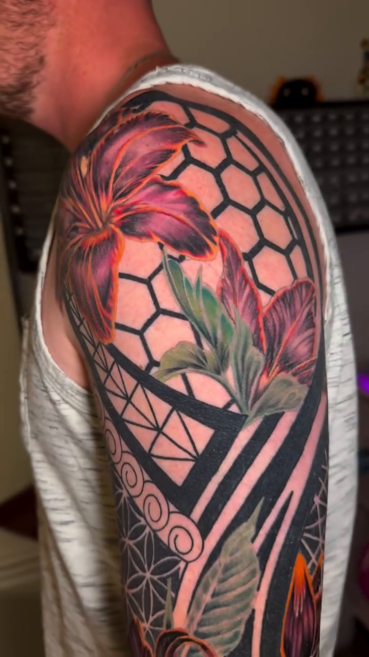 Floral and geometric sleeve tattoo tribal tattoo on the upper arm by Kimberly Parton- Chapel Hill Tattooer, Chapel Hill, North Carolina