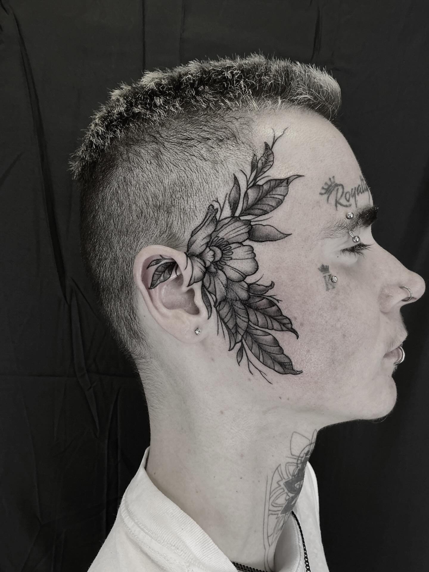 Floral black and grey tattoo on the head by Brookelyn
