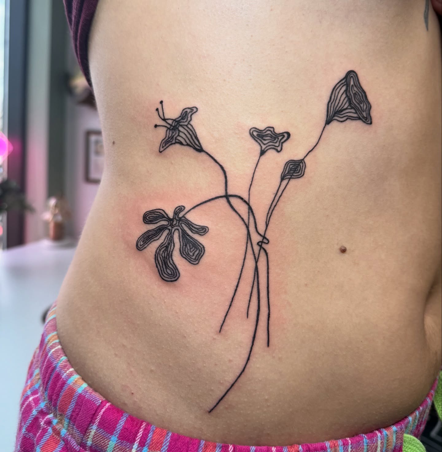 Flowers black and grey tattoo on the torso by 🌸Blossom🌸