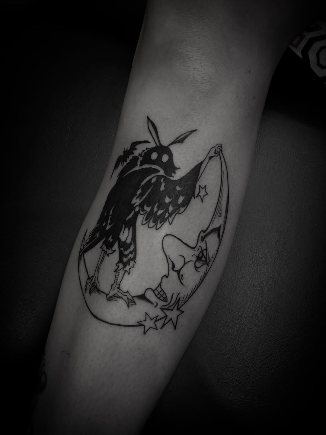 Mothman on moon realism tattoo on the forearm by Joe Khay, Hackettstown, New Jersey