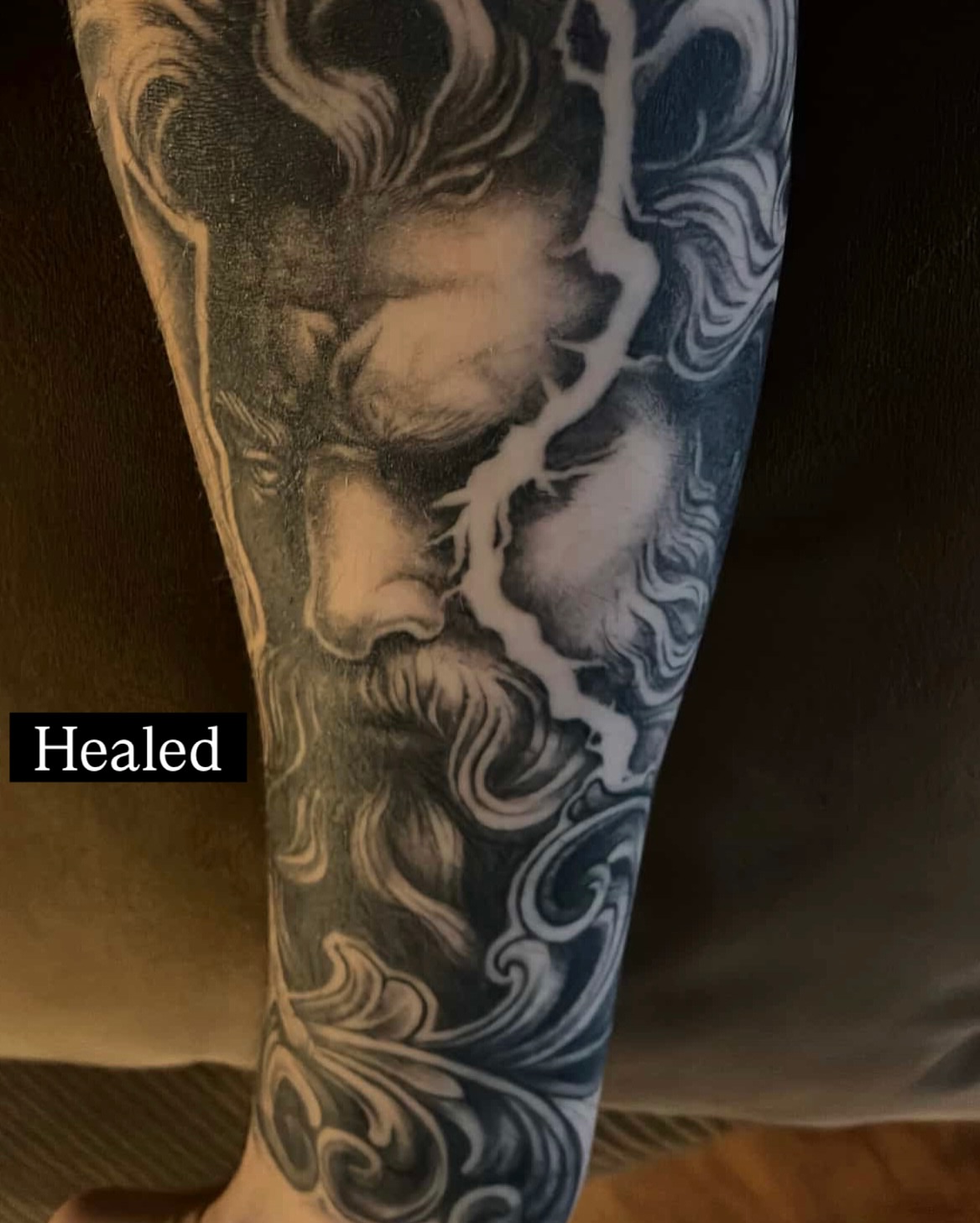 God-like figure realism tattoo on the forearm by Kelsey Zussman