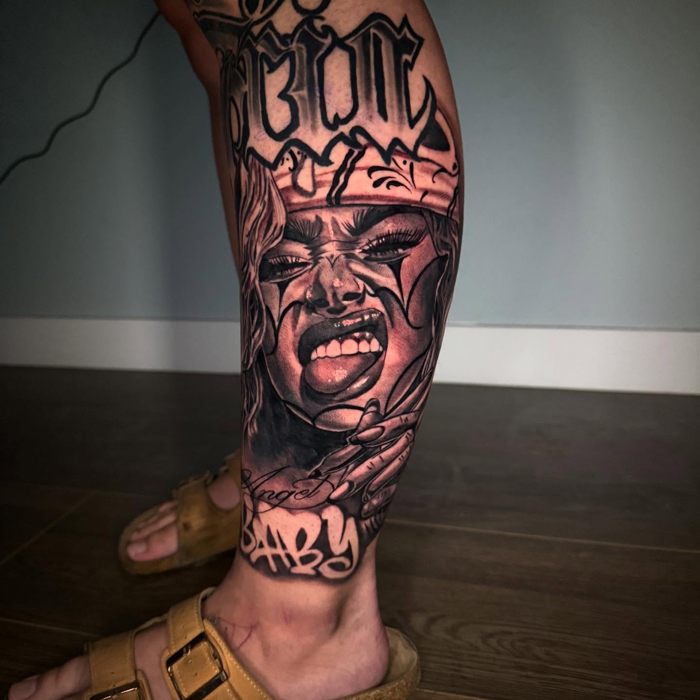 Angry woman realism tattoo on the calf by Joseph Pacheco