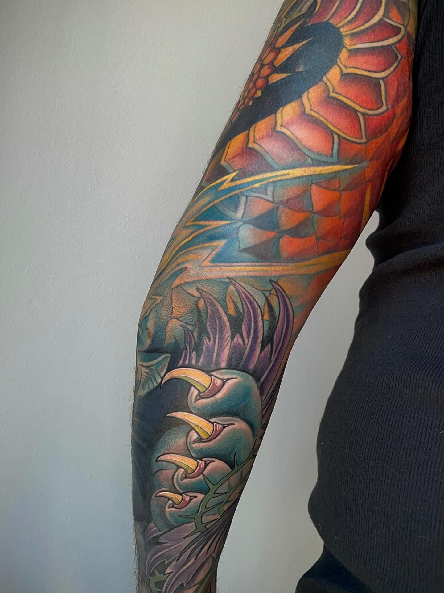 Dragon geometric tattoo on the forearm by Samantha Castrovinci, Durham, North Carolina