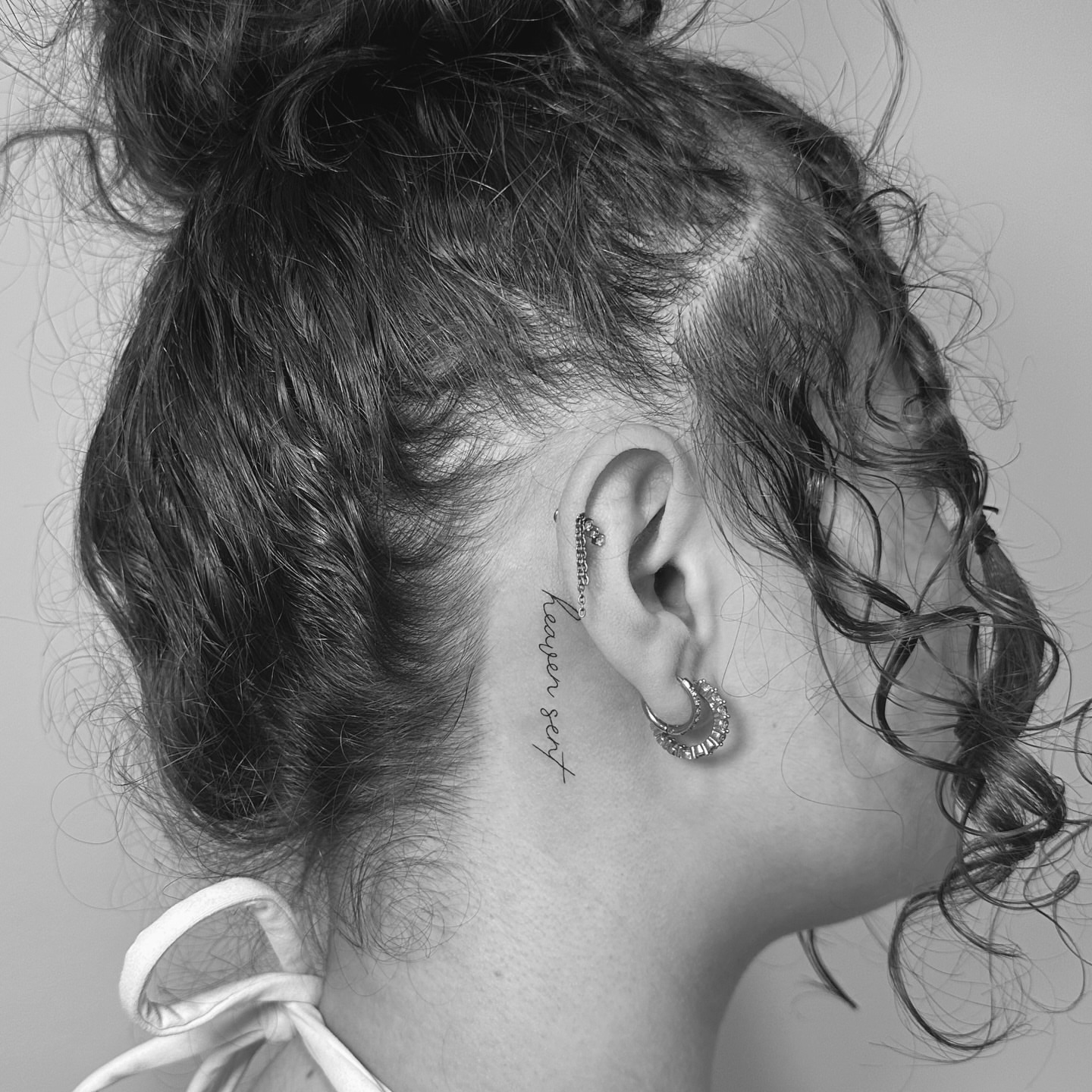 Script lettering lettering script tattoo on the neck by Jessica, Cheektowaga, New York