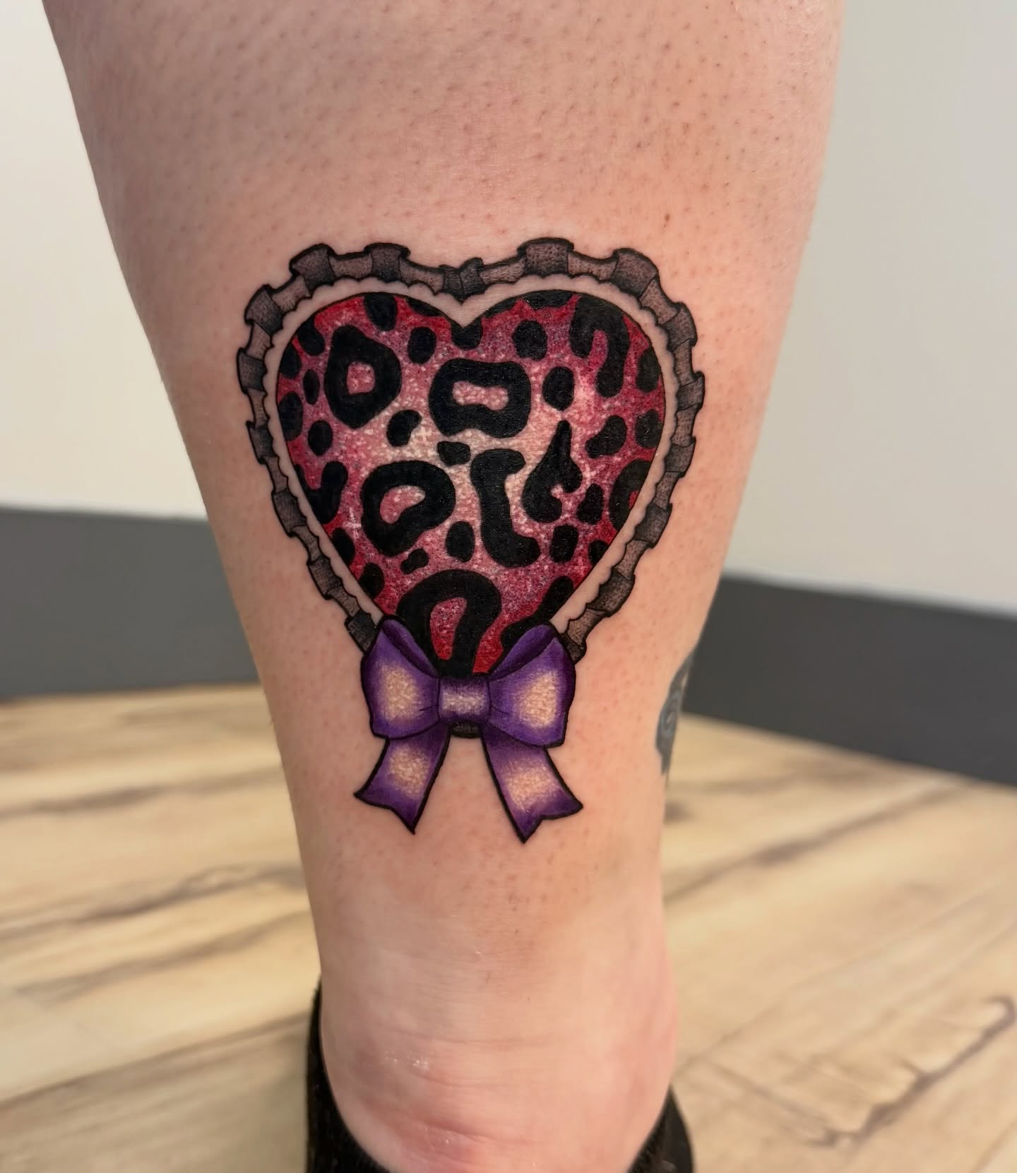 Heart with leopard print new school tattoo on the leg by kobeigh