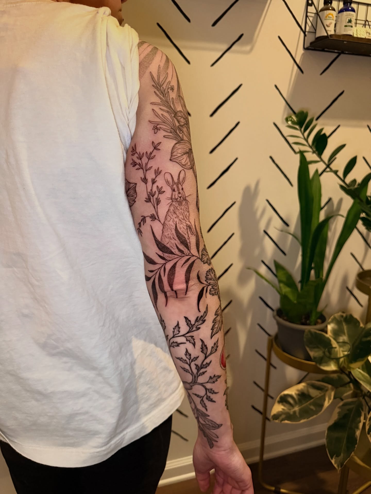 Rabbit and foliage black and grey tattoo on the forearm by ππ£ππ€π₯π ππ¦ππ‘π, Lakewood, Colorado