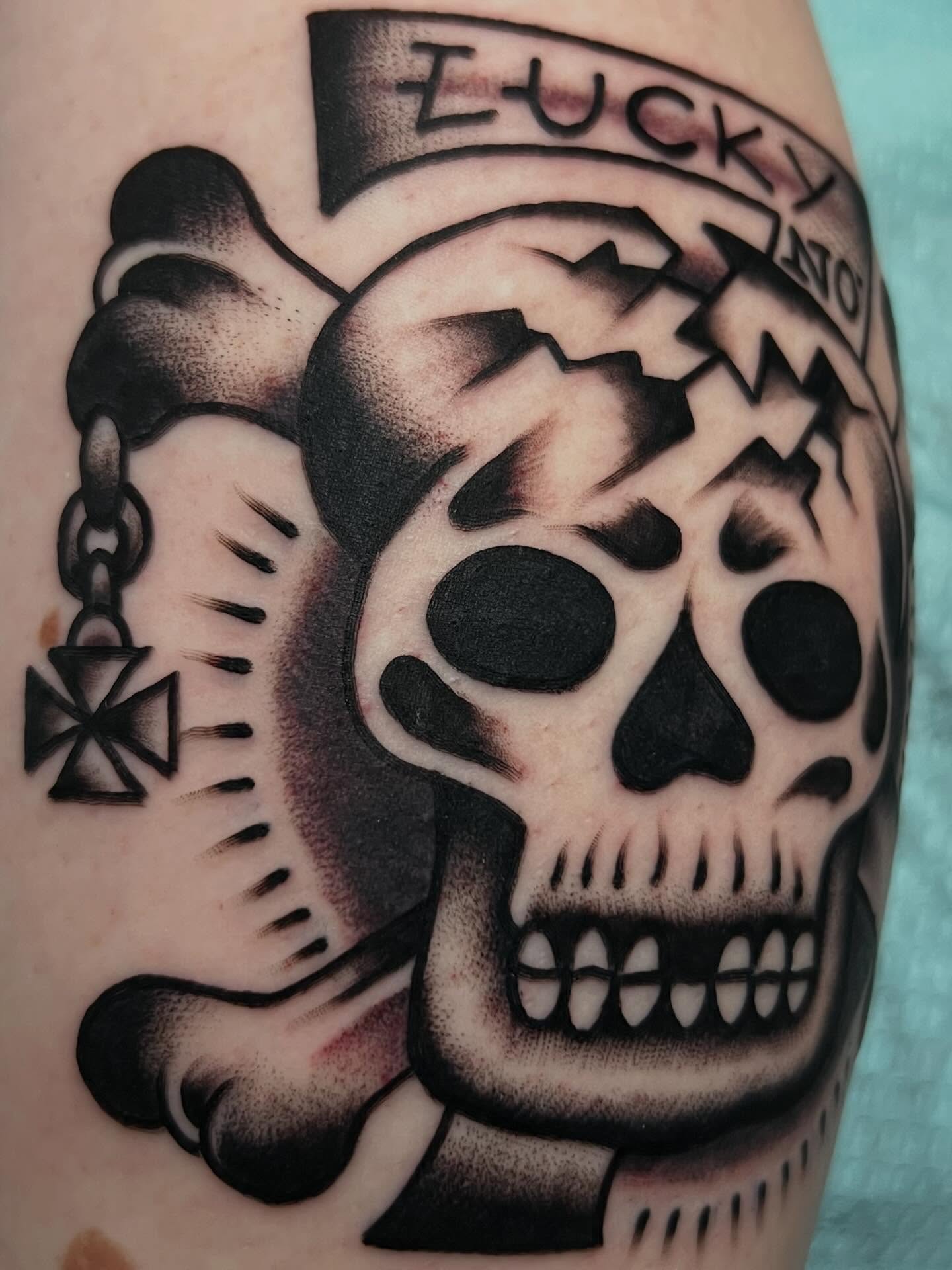 Skull American traditional tattoo on the forearm by Charlie Campanella