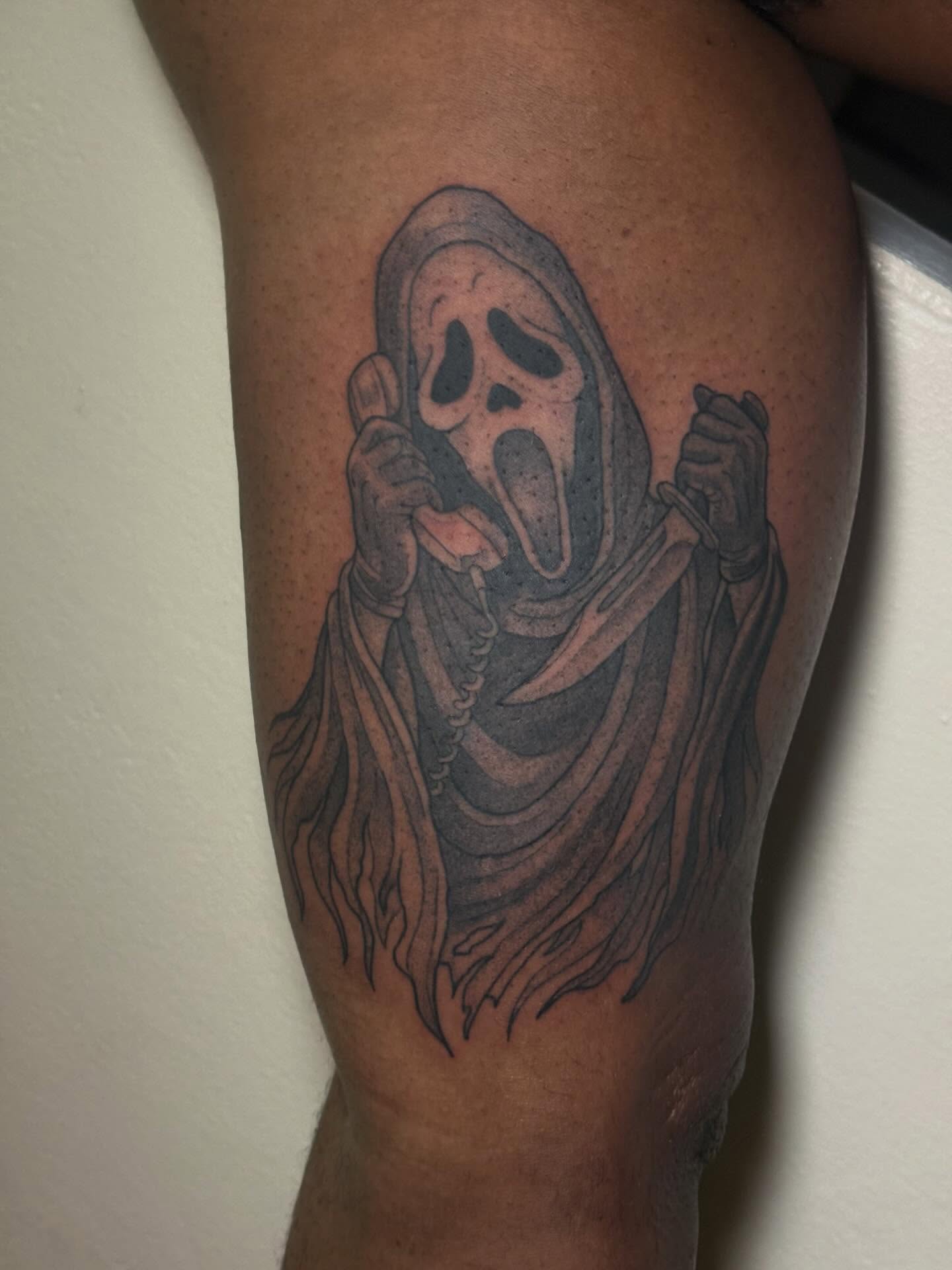 Scream Ghost black and grey tattoo on the thigh by Shampooh