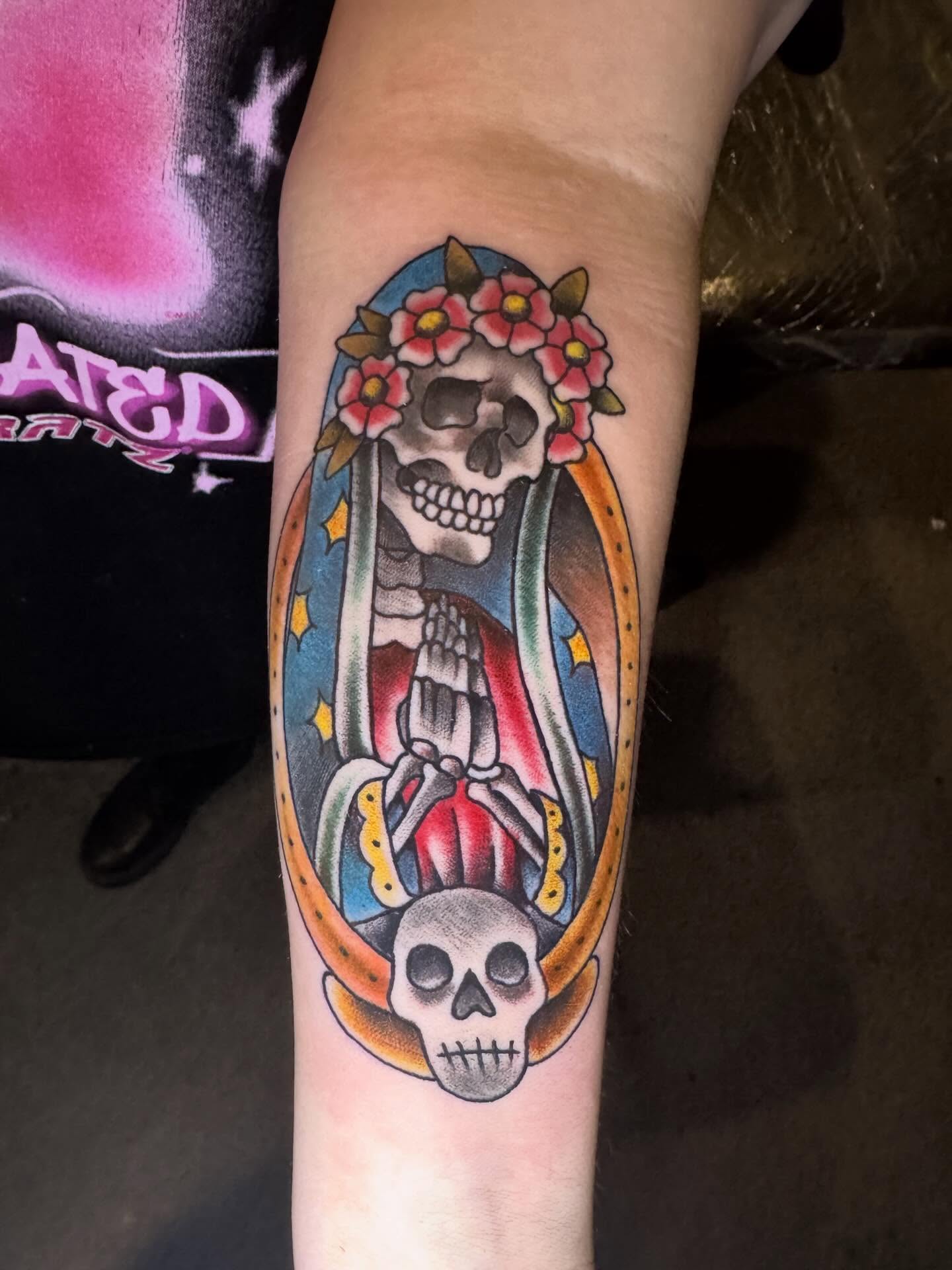 Skeleton with floral crown American traditional tattoo on the forearm by Mike Bean, Minneapolis, Minnesota