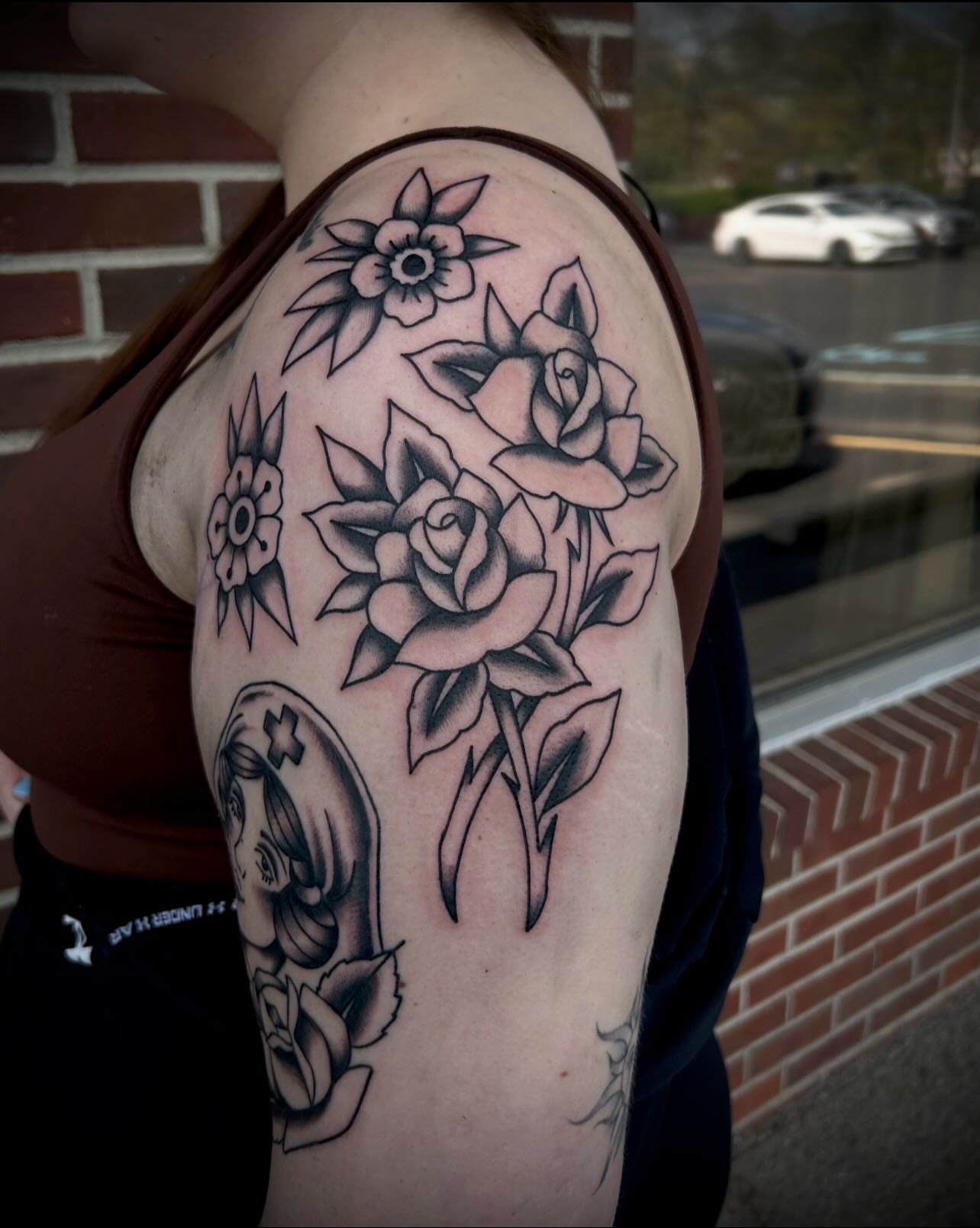 Floral arrangement American traditional tattoo on the shoulder by Heaven Arianna