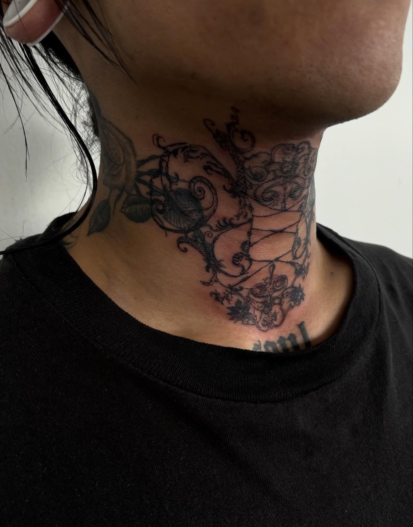 Floral vine black and grey tattoo on the neck by madeline