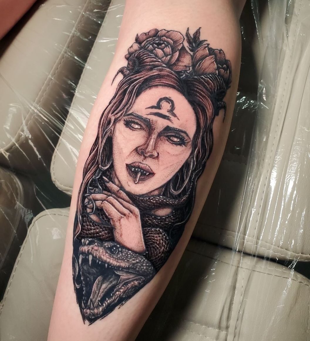 Woman with snake realism tattoo on the forearm by Matthew Ray, Harrisburg, North Carolina