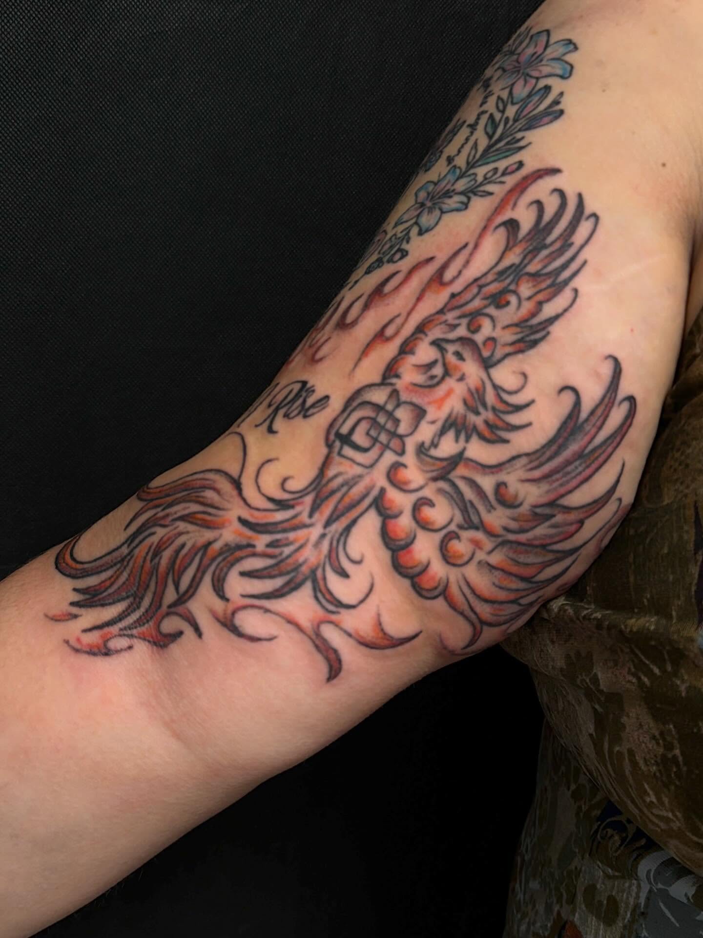 Phoenix American traditional tattoo on the forearm by cortez