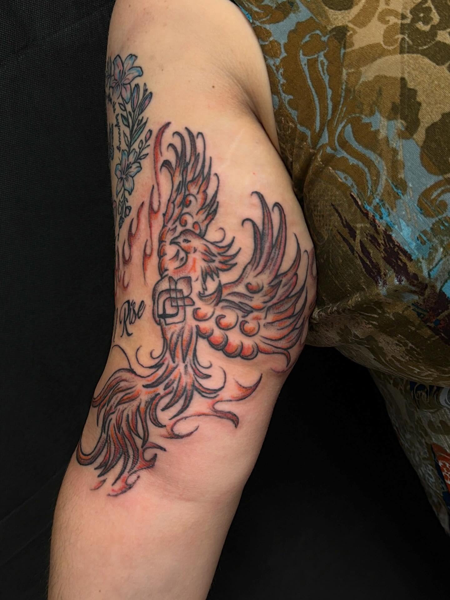 Phoenix neo-traditional tattoo on the forearm by cortez