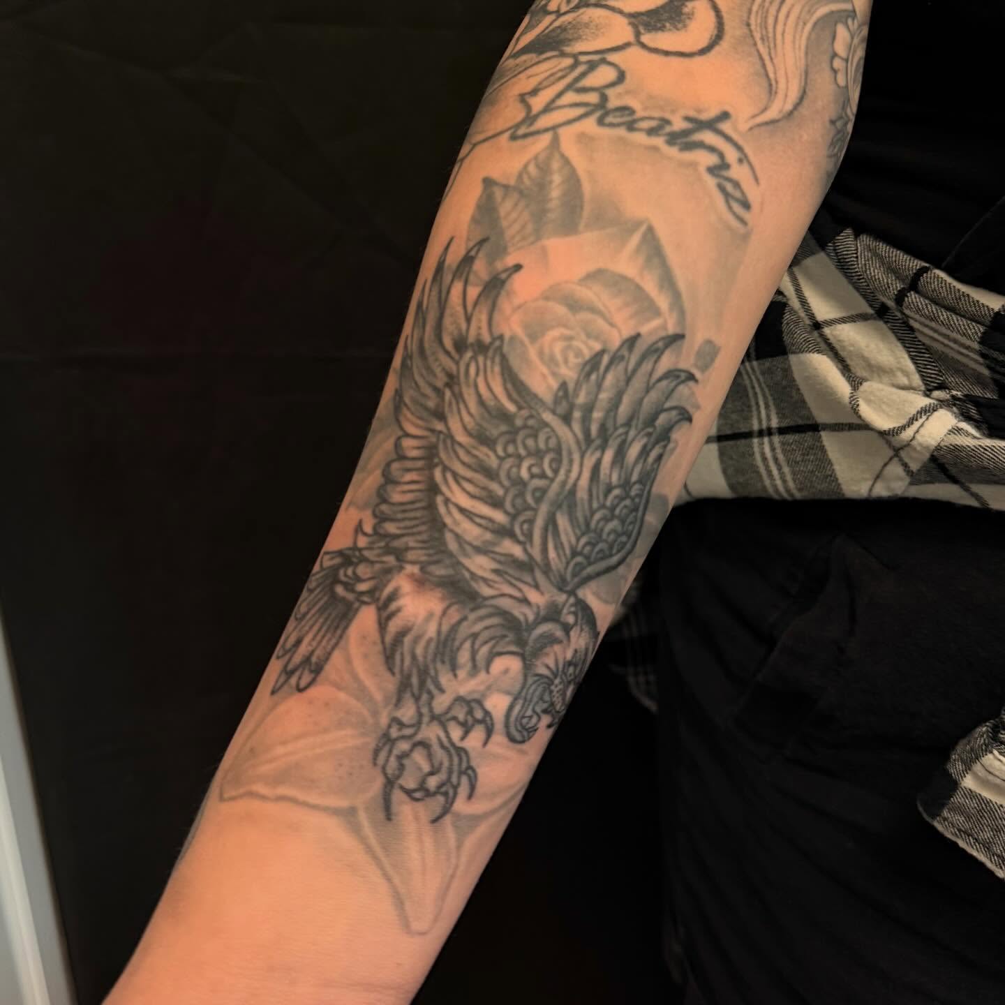Bird and lotus black and grey tattoo on the forearm by cortez