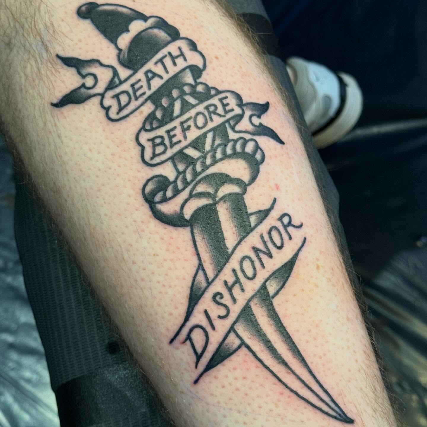 Sword and ribbon American traditional tattoo on the forearm by Jack Hatchet Tattoos