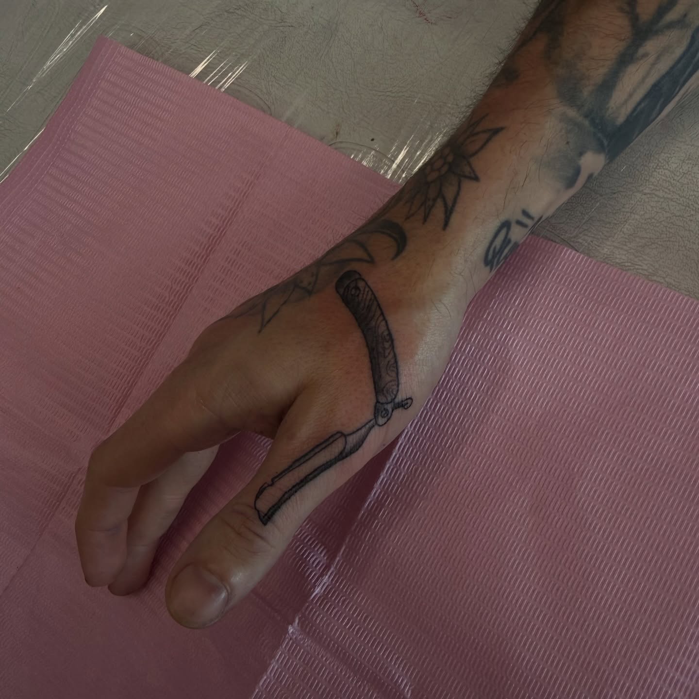Razor blade black and grey tattoo on the forearm by Nina Nichole