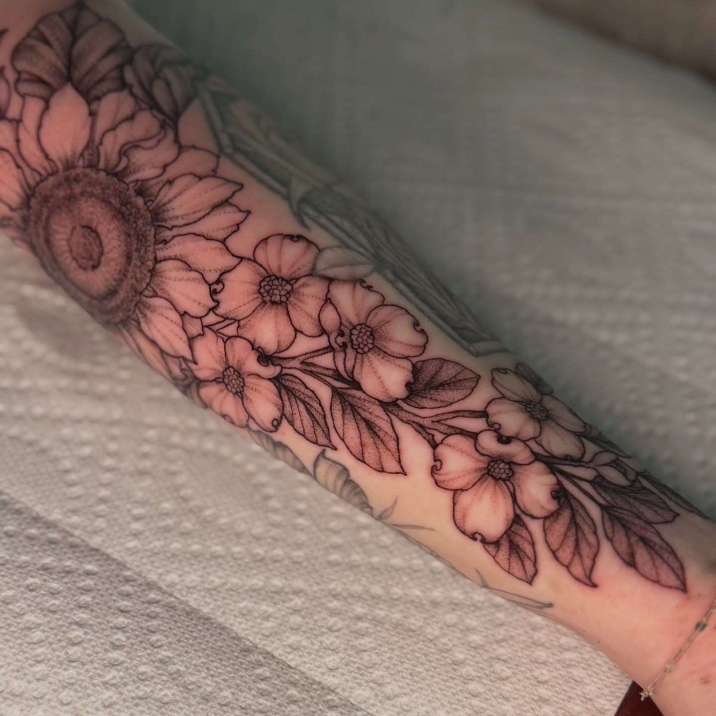Flower bouquet black and grey tattoo on the forearm by Chiah