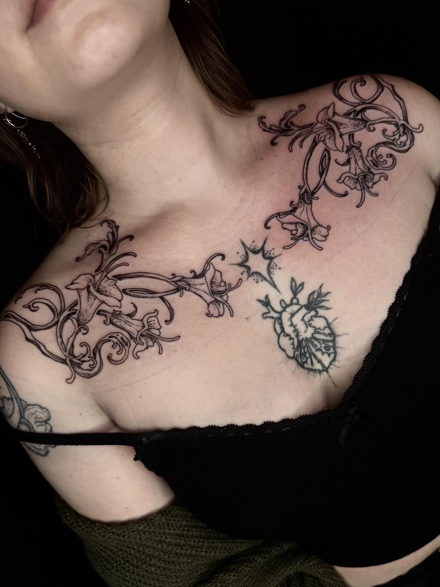 Flowers and heart black and grey tattoo on the chest by Isabella π€
