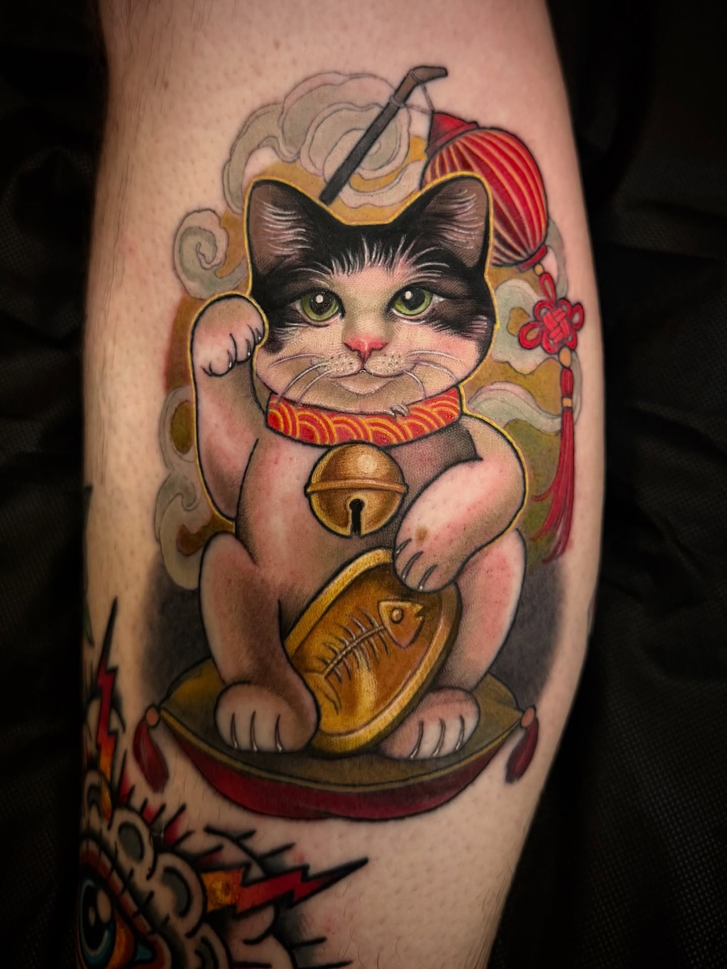 Lucky cat American traditional tattoo on the forearm by Jessica Brown
