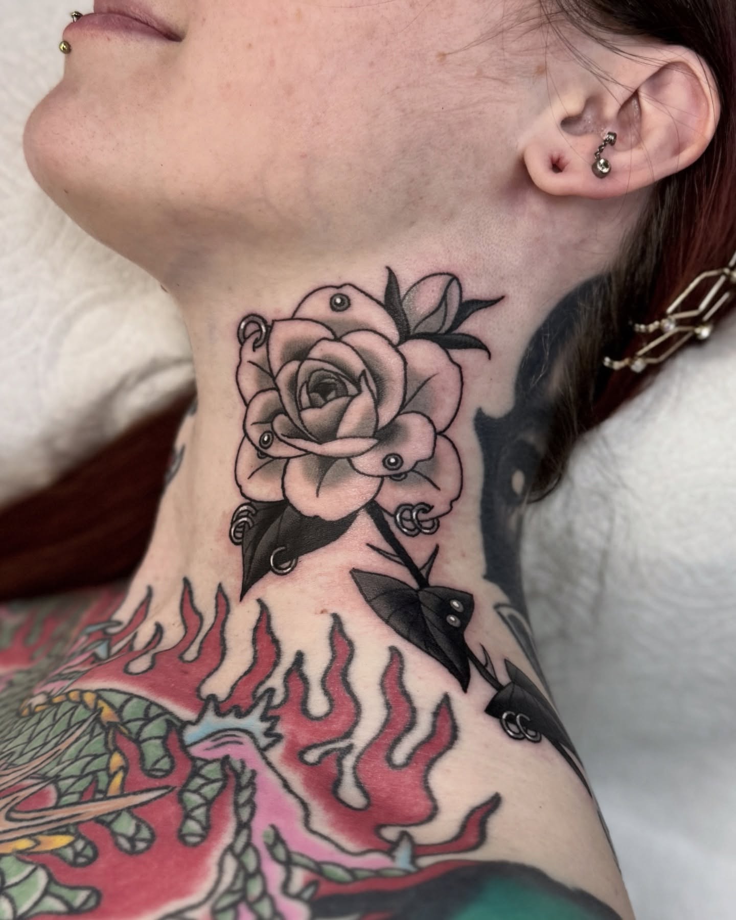 Rose and flames American traditional tattoo on the neck by Nia (Knee-uhh) 🦷