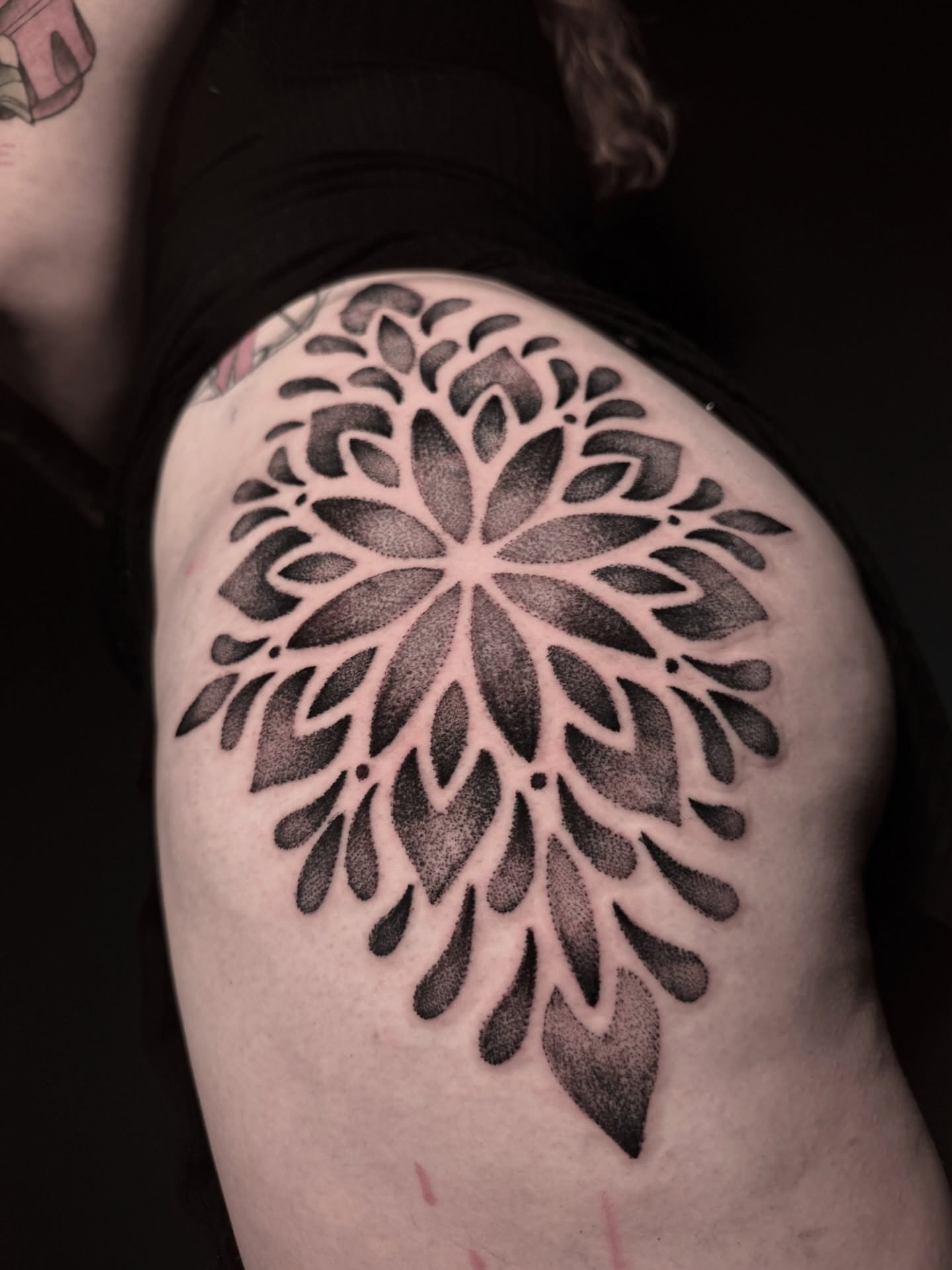 Floral mandala dotwork tattoo on the shoulder by Alex Cantor