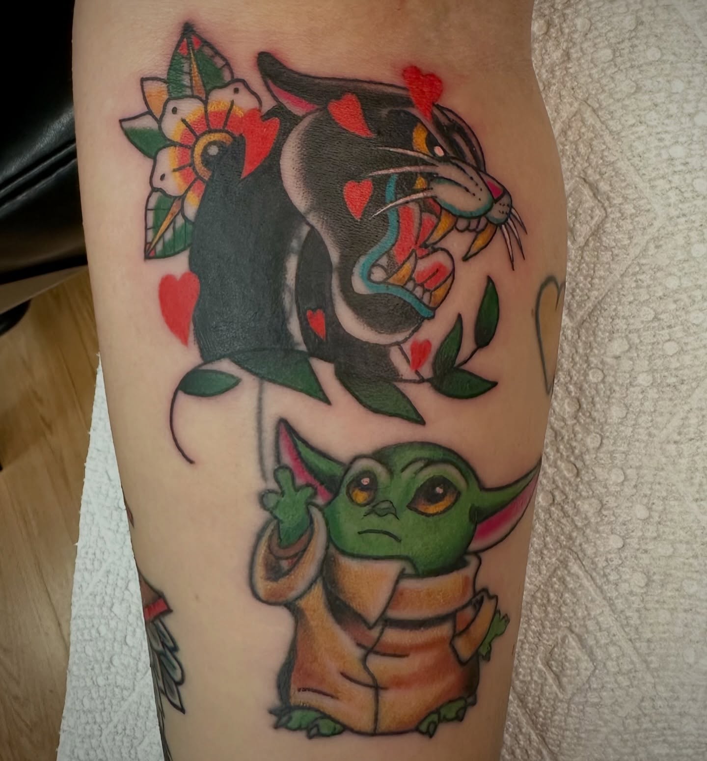 Baby Yoda and panther American traditional tattoo on the forearm by Josh Robinson