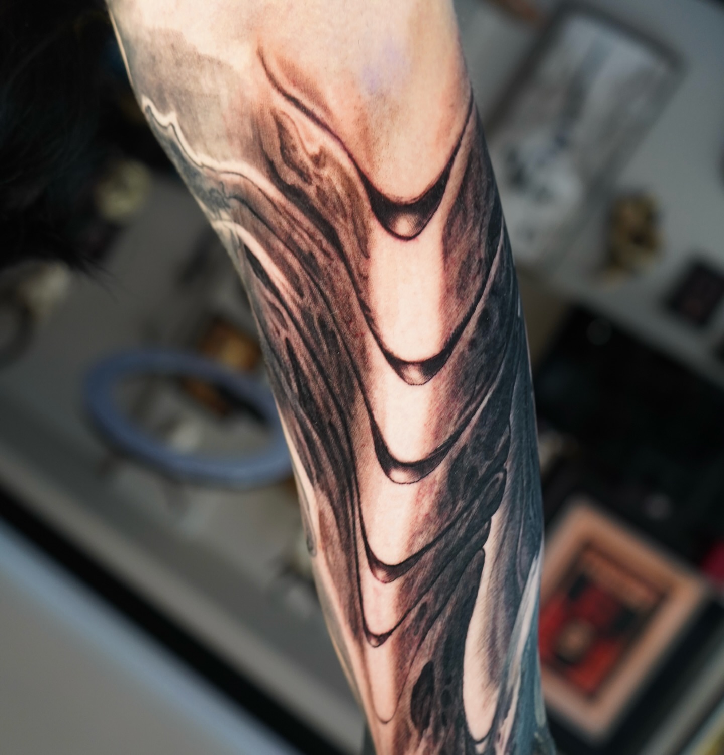 Abstract pattern black and grey tattoo on the forearm by Darl Gnau