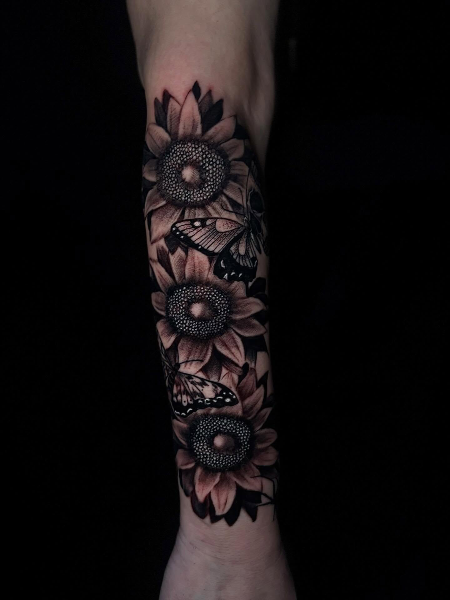 Sunflowers and butterflies dotwork tattoo on the forearm by Lee