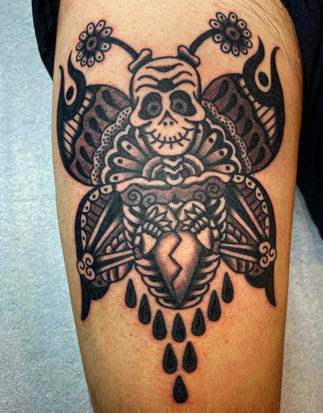 Skull butterfly with broken heart realism tattoo on the thigh by Swasthik Iyengar, New York, New York
